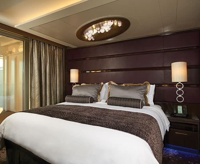 The Haven's Owners Suite with Large Balcony Bedroom on Norwegian Breakaway