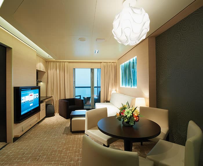 The Haven's 2-Bedroom Family Villa with Balcony Living Room on Norwegian Breakaway
