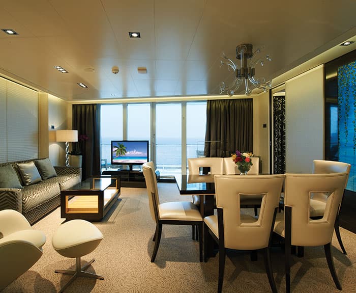 The Haven's Deluxe Owners Suite with Large Balcony Living Room on Norwegian Getaway