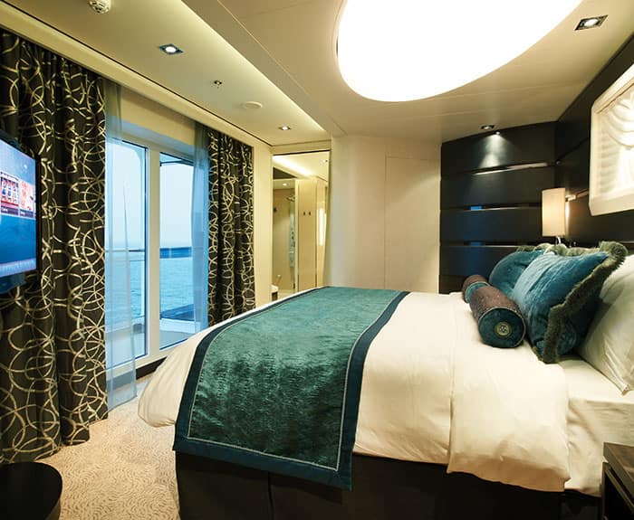 The Haven's Deluxe Owners Suite with Large Balcony Bedroom on Norwegian Getaway