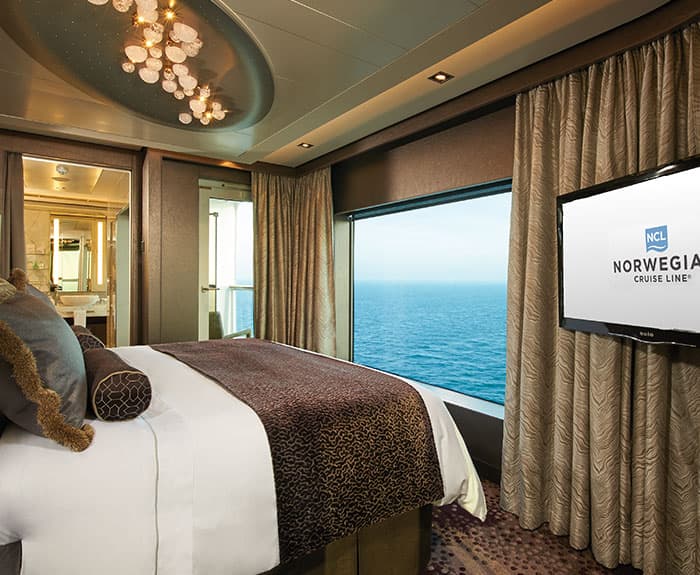 The Haven's Deluxe Owners Suite with Large Balcony Bedroom on Norwegian Escape