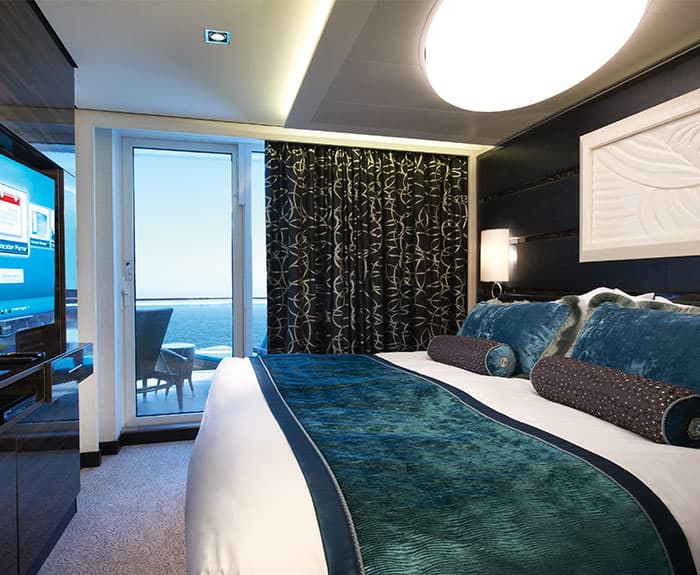 The Haven's Owners Suite with Large Balcony Bedroom on Norwegian Breakaway