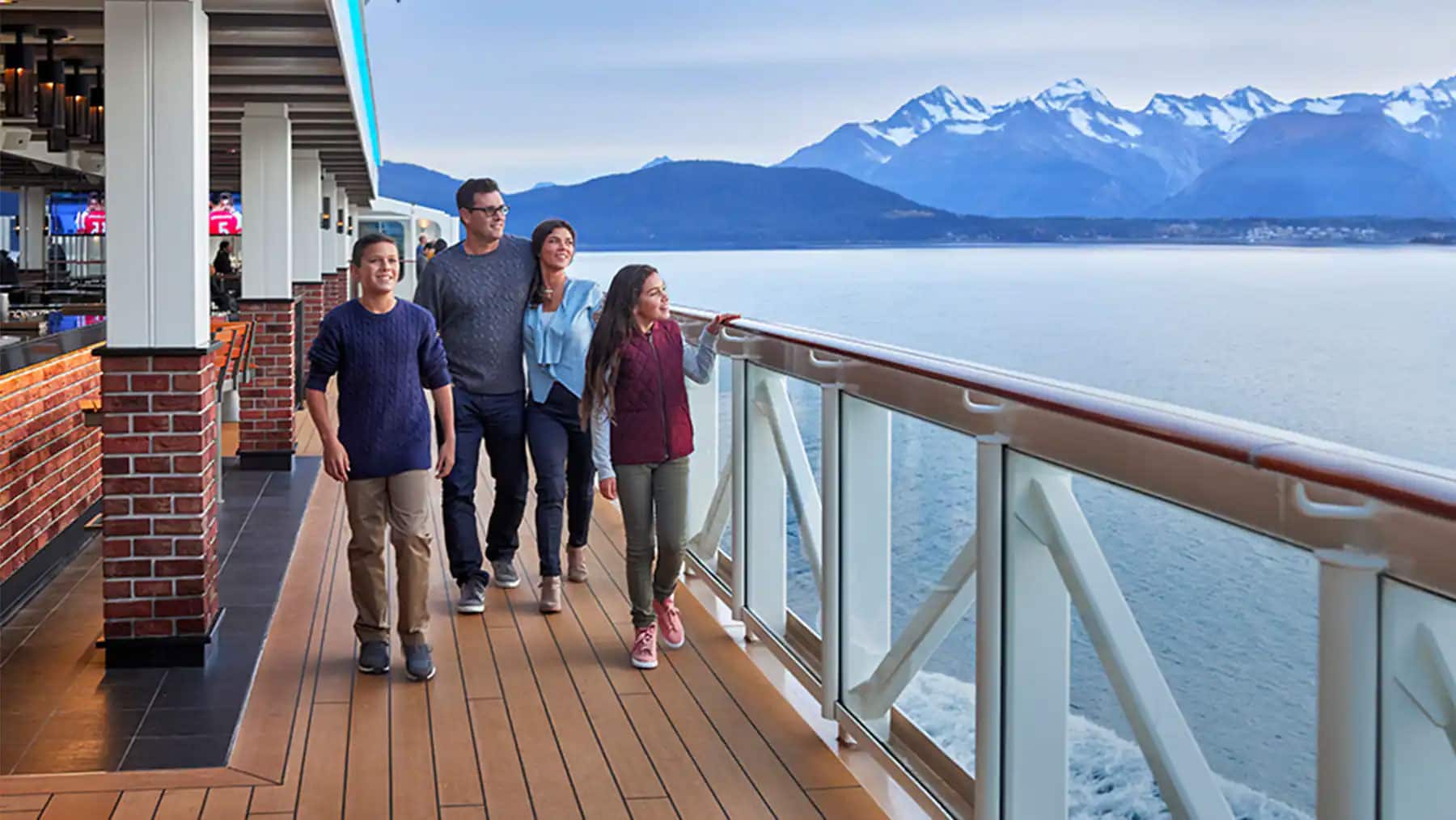 Family enjoys walking the Norwegian Bliss cruise ship waterfront and sightseeing 